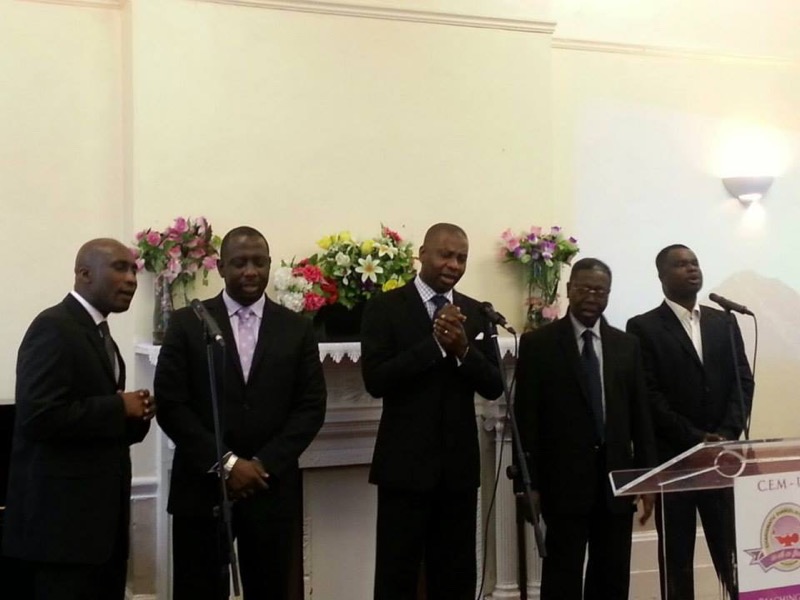 Men of the church standing together at the front during a service