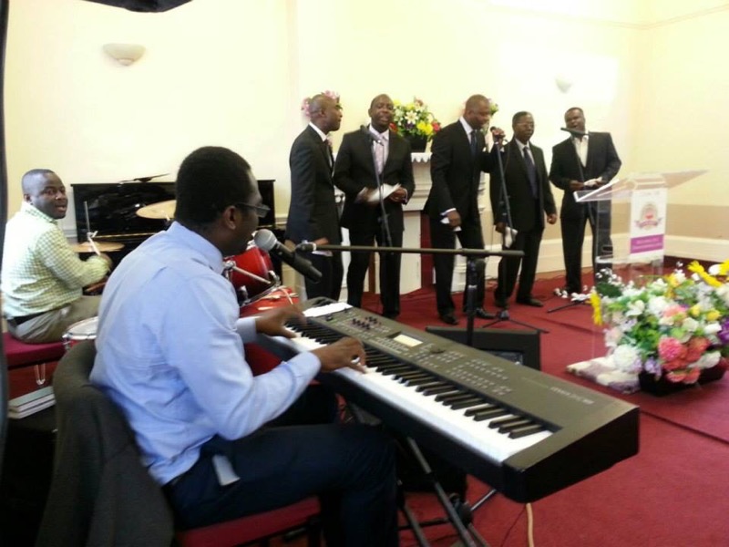 A keyboard player accompanying the choir during a service
